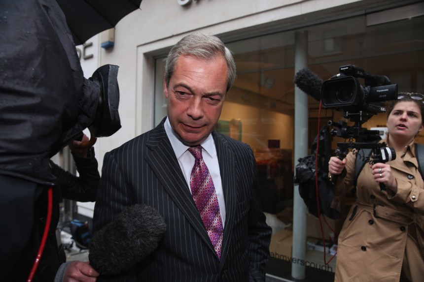 LONDON, ENGLAND - MAY 14:  UKIP leader Nigel Farage leaves the party's HQ in Mayfair on May 14, 2015 in London, England. Mr Farage is under new pressure after Ukip's campaign director Patrick O'Flynn said that 'Nigel Farage is 'snarling, thin-skinned and aggressive'. Last week Mr Farage submitted his resignation as party leader, following the general election, but remained in his position after the party's refusal to accept it.  (Photo by Dan Kitwood/Getty Images)