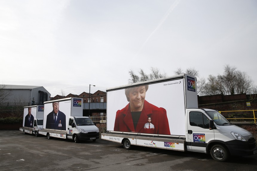 A Conservative election poster showing Britain's opposition Labour Party leader in the pocket of Nicola Sturgeon, the leader of the Scottish National Party, is seen on a truck parked outside Granada studios in Manchester