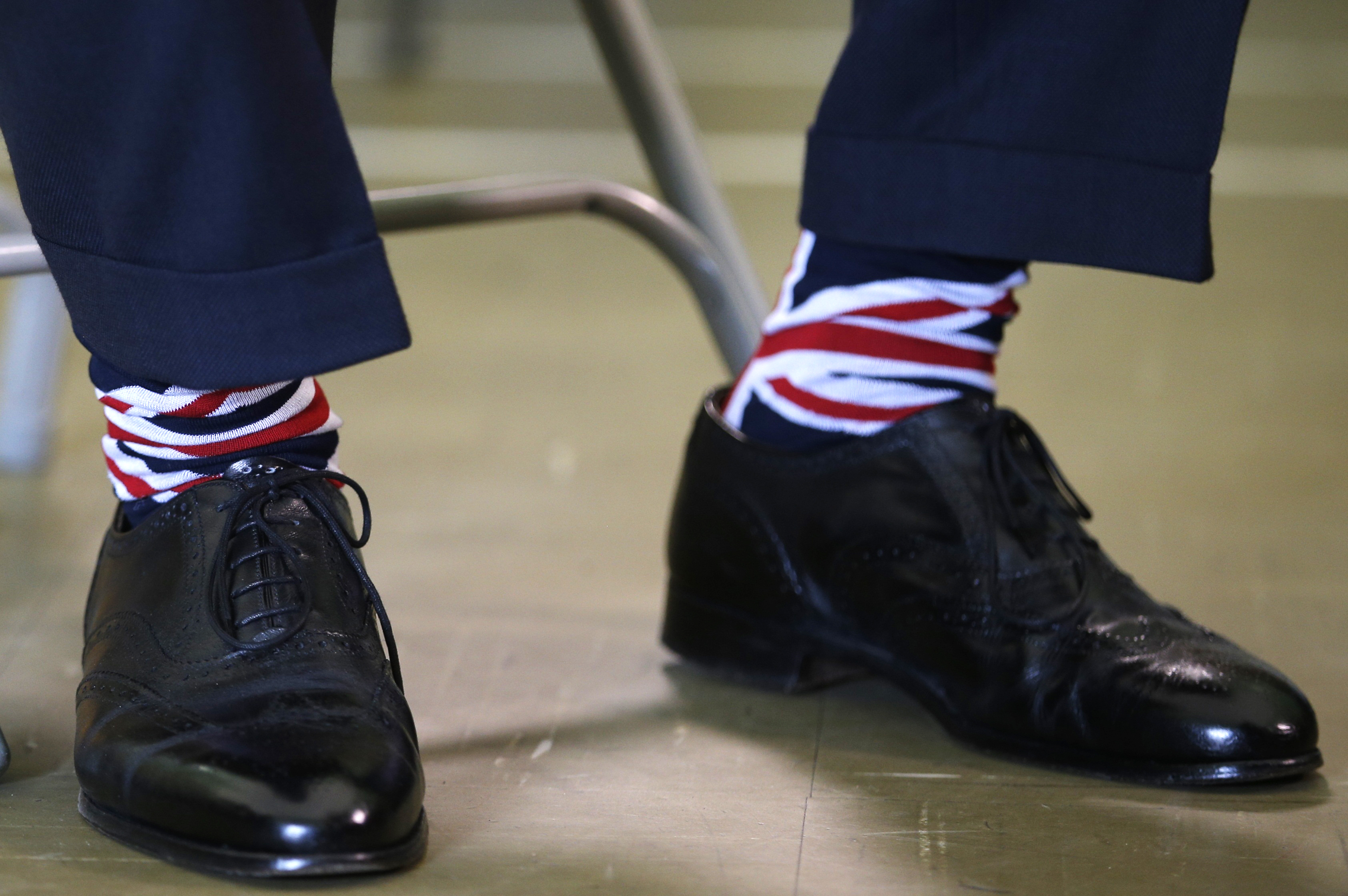 Nigel Farage, the leader of the United Kingdom Independence Party, wears Union Flag themed socks during a visit to a community centre in Clacton, Essex