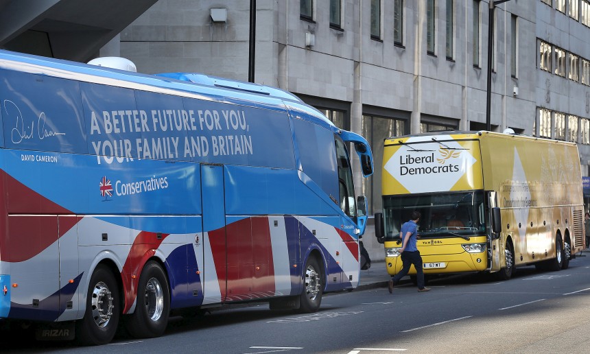 The Conservative party election bus faces the Liberal Democrat bus before a day of campaigning in London