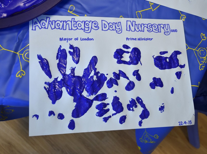 Hand prints are seen on paper after Britain's Prime Minister Cameron and London Mayor Johnson joined a hand-printing session with children at the Advantage children's daycare nursery in Surbiton in south west London