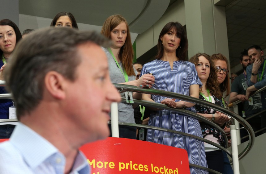LEEDS, ENGLAND - MAY 01:  The wife of Prime Minister and leader of the conservatives David Cameron, Samantha Cameron, looks on above as her husband addresses workers at the head office of supermarket giant Asda on May 1, 2015 in Leeds, England. As the campaign enters the final days, the country's political parties are stepping up the campaign to appeal for votes from the undecided electorate.  (Photo by Christopher Furlong/Getty Images)