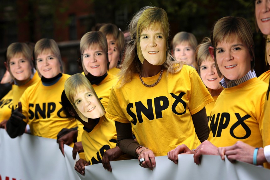 LONDON, ENGLAND - MAY 01:  Conservative Party supporters wear Nicola Sturgeon masks during a photocall in Victoria Tower Gardens on May 1, 2015 in London, England. The stunt was to warn of the risk of any possible coalition between the Labour Party and the SNP. Britain goes to the polls in a general election on May 7. (Photo by Dan Kitwood/Getty Images)